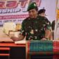 Inspektur Kodam (Irdam) XIV Hasanuddin Brigjen TNI Berlin Germany, saat memukul gendang sebagai tanda tournament Karate Championship 2025 resmi dibuka, di JK Arenatorium GOR Universitas Hasanuddin (Unhas), Jl. Politeknik, Kota Makassar, Jumat (23/5/25).